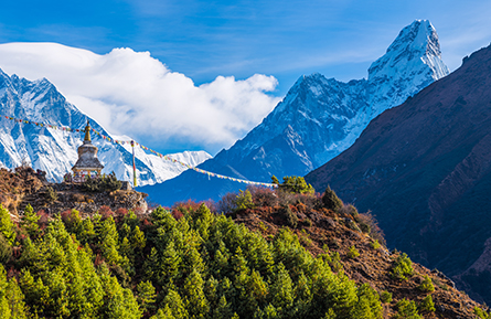 Everest Lhotse Ama Dablam overlooking Bhuddist Stupa prayer flags Himalayas